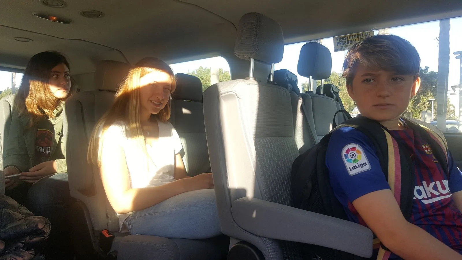 Two passengers seated in a ZiiP van