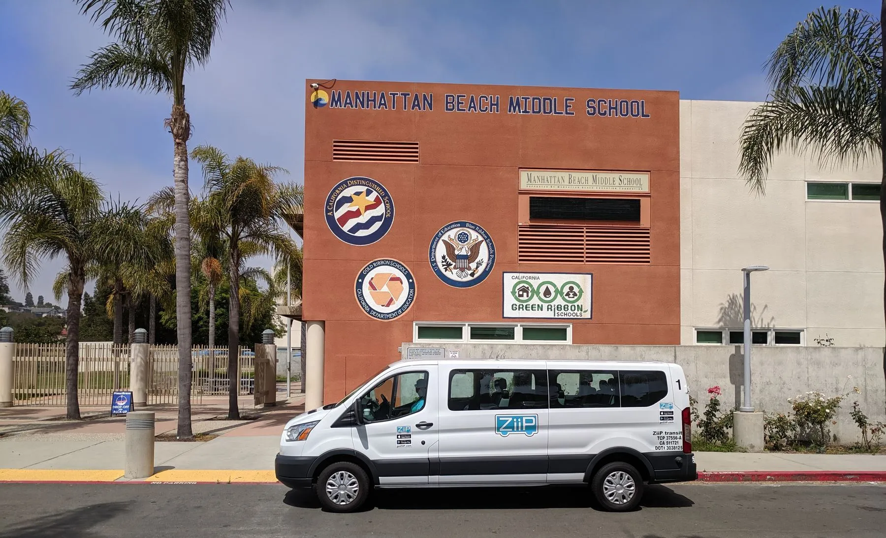 A ZiiP van waiting outside a Manhattan Beach school