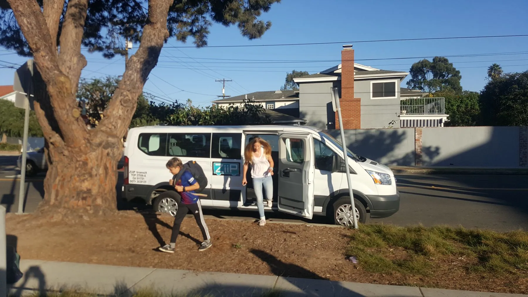 A ZiiP van dropping off on a residential street